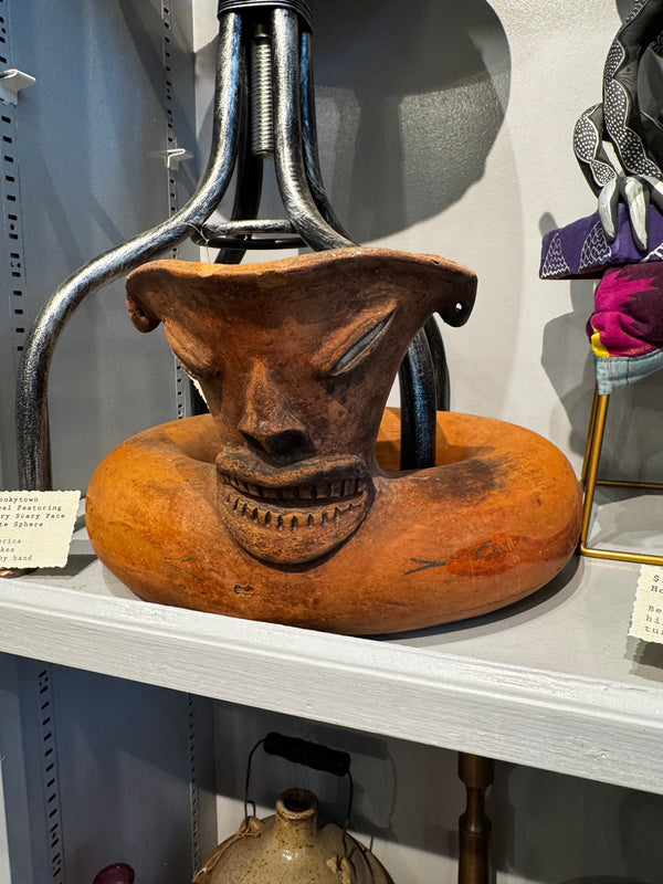 Vessel with Spooky Face and Agate Sphere